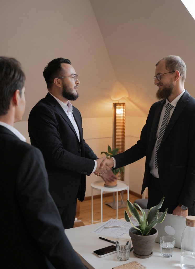 a group of men shaking hands, iso consultancy, trust your partner